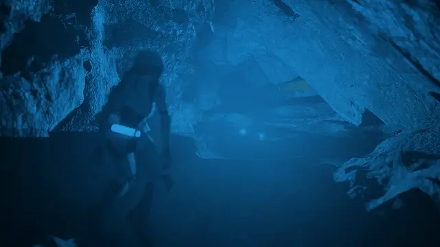 A Caretaker descending into a blue underwater cave in The Last Caretaker.